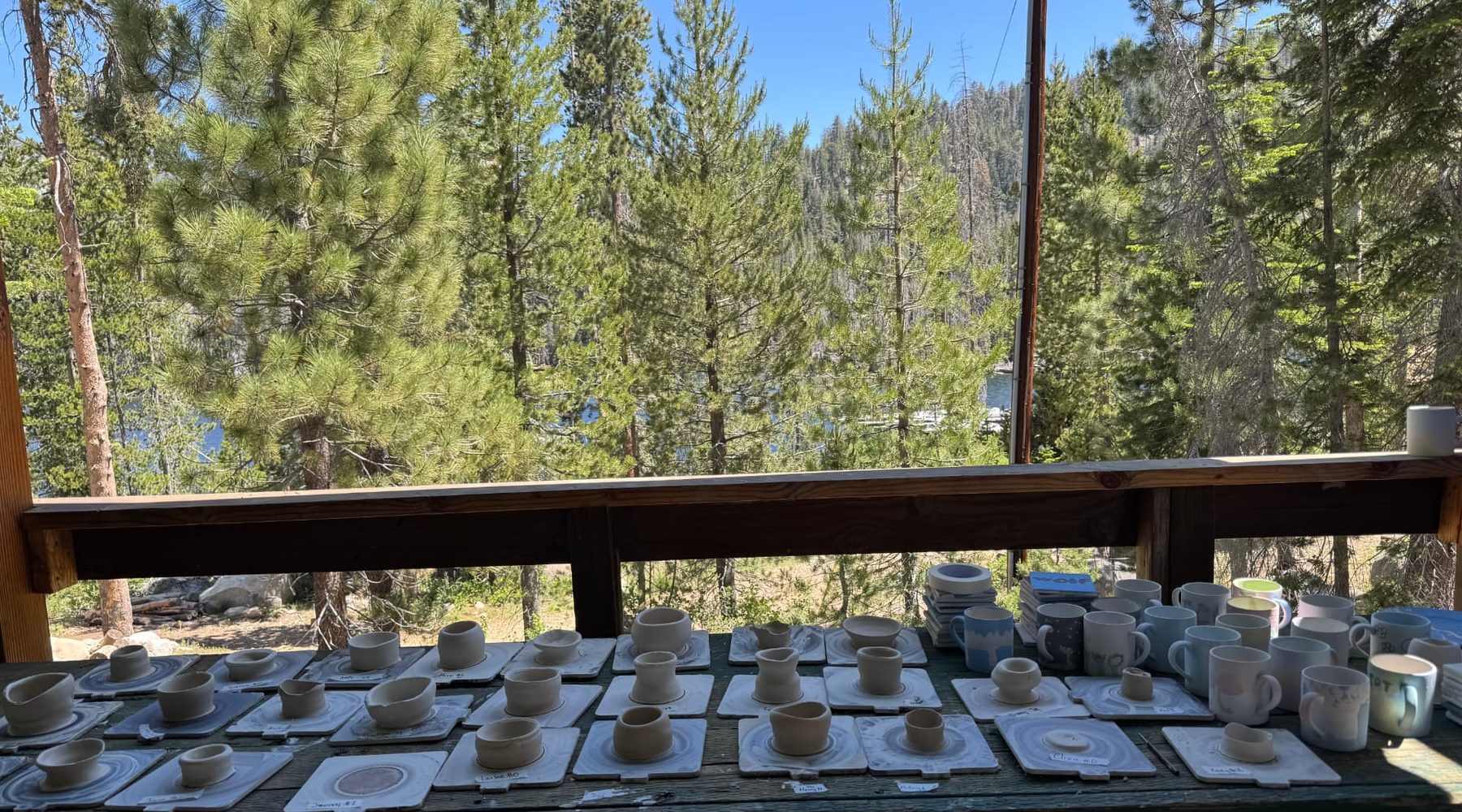 Shelves of finished camp craft projects